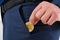 Gold Bitcoin. Businessman in suit put bit-coin into pocket. Success concept and business background. Selective focus