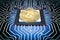 Gold bitcoin on circuit board