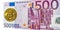 Gold bitcoin coin of 500 euro banknote five hundred