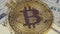 Gold Bitcoin Coin Cryptocurrency, BTC Rotate on Background with US Dollars