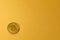 Gold bitcoin crypto currency coin on gold yellow backgound