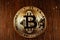 Gold Bitcoin on dark surface, Cryptocurrency and Blockchain concept visualization
