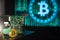 Gold Bitcoin with hard disk, green binary screen in the background