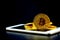 Gold bitcoin on tablet computer isolated on black background, coin money currency virtual digital exchange cash