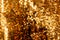 Gold blurred background with sequins, 2021 trend