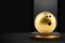 Gold bowling ball on a podium