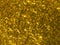 Gold brilliant glitter confetti background.