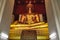 Gold Buddha statue, black base in beautiful meditation