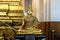 Gold Buddha statue, black base in beautiful meditation