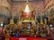 Gold buddha statue in a church in Thailand