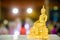 Gold buddha statue on the table. symbol of buddhism religion in thai wedding ceremony. imagr for objects, and background.