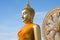 Gold buddha statue in Thai temple with clear sky.WAT MUANG, Ang Thong, THAILAND.