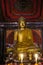 Gold buddha statue at Wat Sri Rong Muang, Lampang, Thailand.