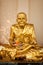 Gold buddhist monk statue