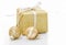 Gold Christmas gift box with bauble decorations isolated on whit