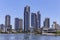 Gold Coast canal view with highrises and small waterfront houses