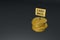 Gold coins with a cashback sign on a black background. 3d render