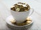 Gold coins on coffee cup