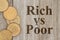 Gold coins with text Rich vs Poor