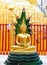 Gold-colored Buddha statue in Buddhist temple