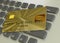 Gold credit card with on computer keyboard