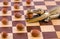 Gold crocodile nut crush tool on chess board