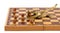 Gold crocodile nut crush tool chess board isolated