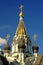 Gold crosses on the dome on the blue sky background on the Church of the Resurrection in Sokolniki, Moscow, Russia