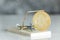 Gold cryptocurrency coin bitcoin in mousetrap on white background. Crypto currency financial trap concept.