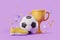 Gold cup with football and boots with confetti, victory concept
