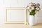 Gold decorated landscape frame mockup with blooming wildflower b