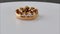 Gold and diamond knot ring rotating on white surface background. 3d render animation of gold and diamond knot ring. Gold and