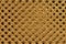 Gold double shiny braided metal mesh with a black background