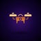 Gold Drone flying icon isolated on black background. Quadrocopter with video and photo camera symbol. Vector