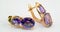 Gold earrings with amethyst inserts