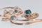 Gold earrings and ring with blue Topaz