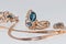 Gold earrings and ring with blue Topaz