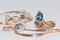 Gold earrings and ring with blue Topaz