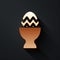 Gold Easter egg on a stand icon isolated on black background. Happy Easter. Long shadow style. Vector.