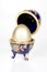 Gold egg in a glass eggcup