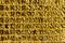 Gold embossed background, square cells. Small golden tile on the wall.