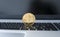 Gold Ethereum coin on a laptop. Ethereum crypto currency on a laptop black keyboard. Digital money and virtual