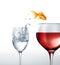 Gold fish smiling jumping from a glass of water, to a glass of red wine.