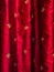 Gold fleur de lis on red silk curtains