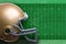 Gold football helmet against field diagram