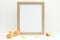 Gold frame mockup. Empty frame mockup on white background with flowers