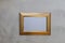 Gold frame mockup on gray wash background flat lay copy space