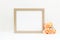 Gold frame mockup. Landscape empty frame mockup on white background with flowers