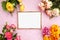 Gold frame for photography, flowers, pink background with sparkles. Flat lat. Top view. Place for text