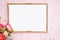 Gold frame for photography, flowers, pink background with sparkles. Flat lat. Top view. Place for text
